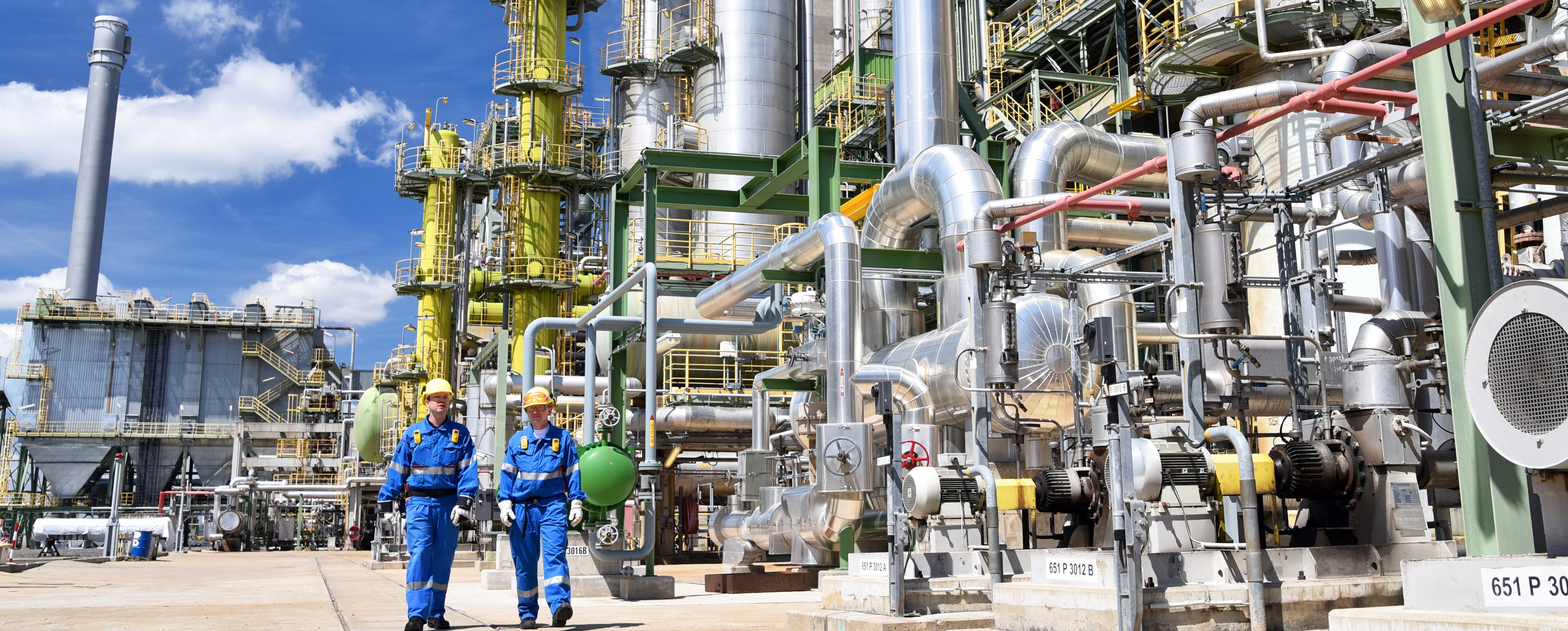 Two men walking refinery site representing KP Engineering's team